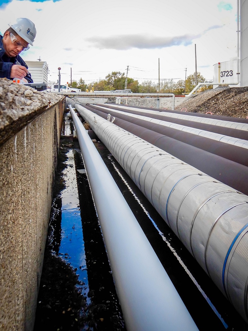 Engineer working on piping replacement Engineer working on piping replacement