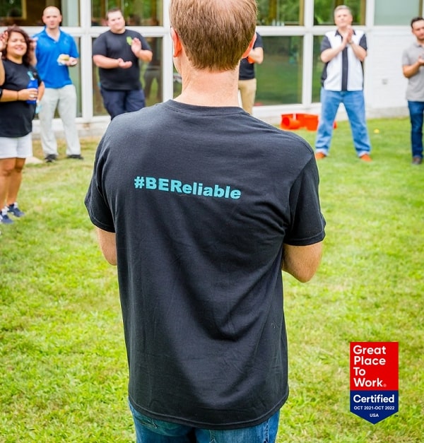 Tom brindley wearing BE reliable shirt with GPTW certified badge