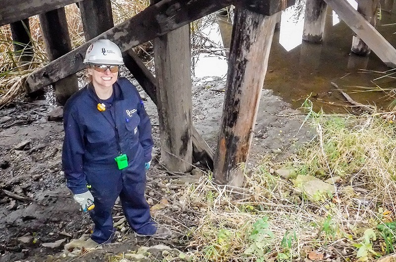 woman engineer on site under bridge