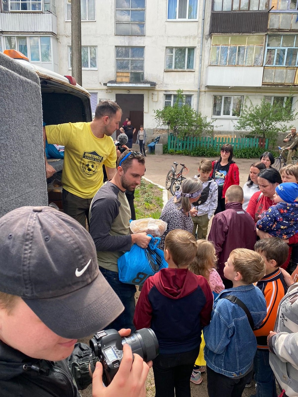 Michael passing out food and water to Ukrainians