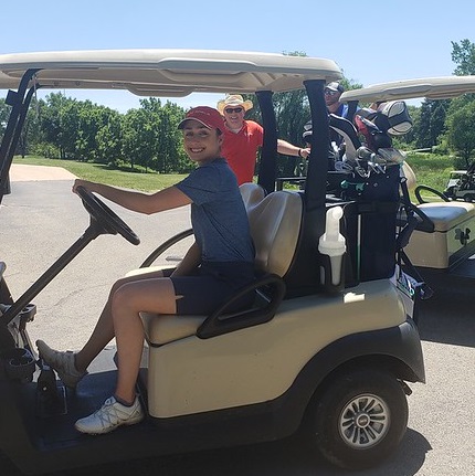 Courteney Fabbri at brindley Golf outing in cart